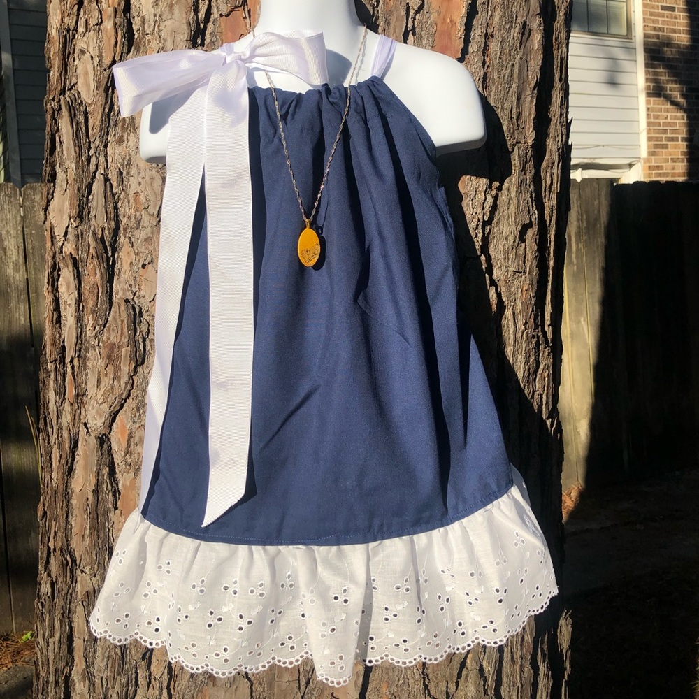 Navy w/ white eyelet trim and long white ribbon